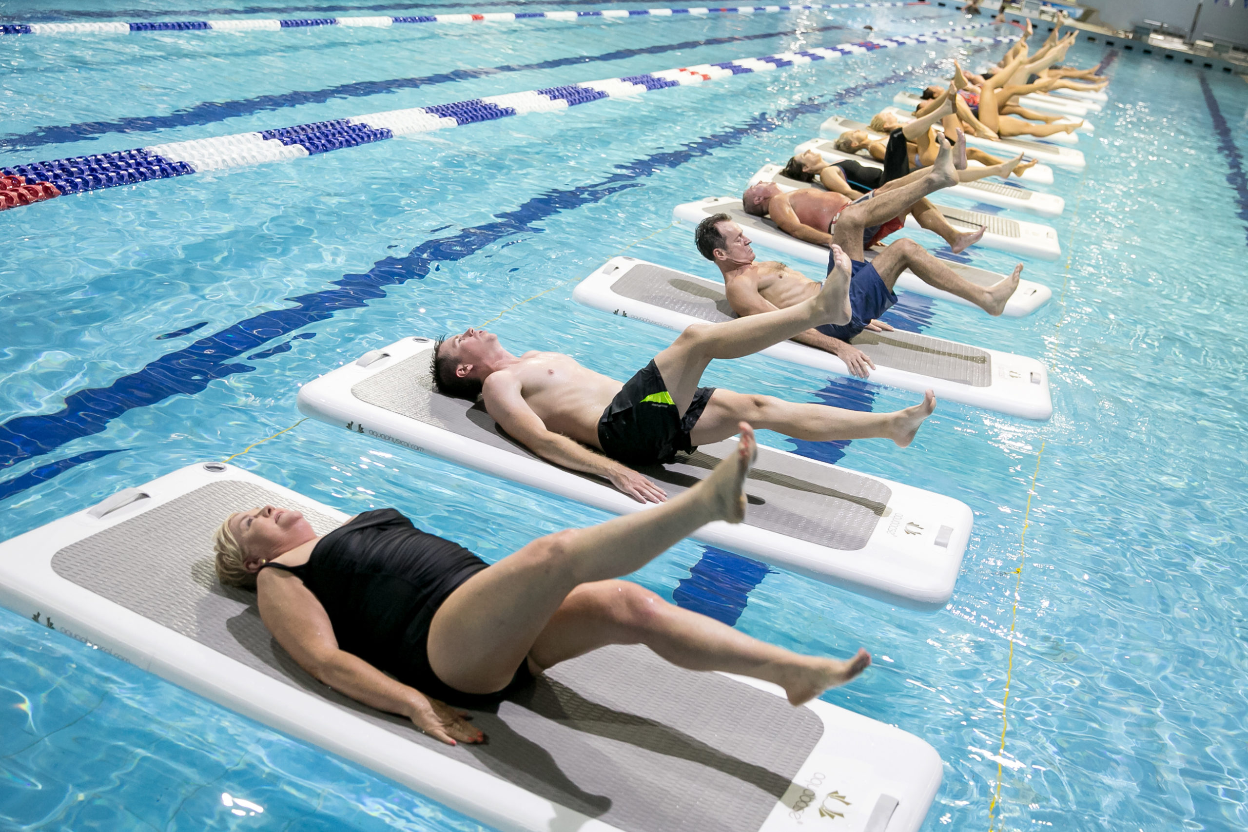 Image of class doing leg raises on One Float platform