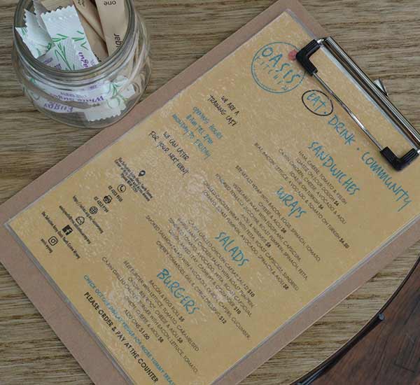 Menu on a clipboard at Oasis Kitchen