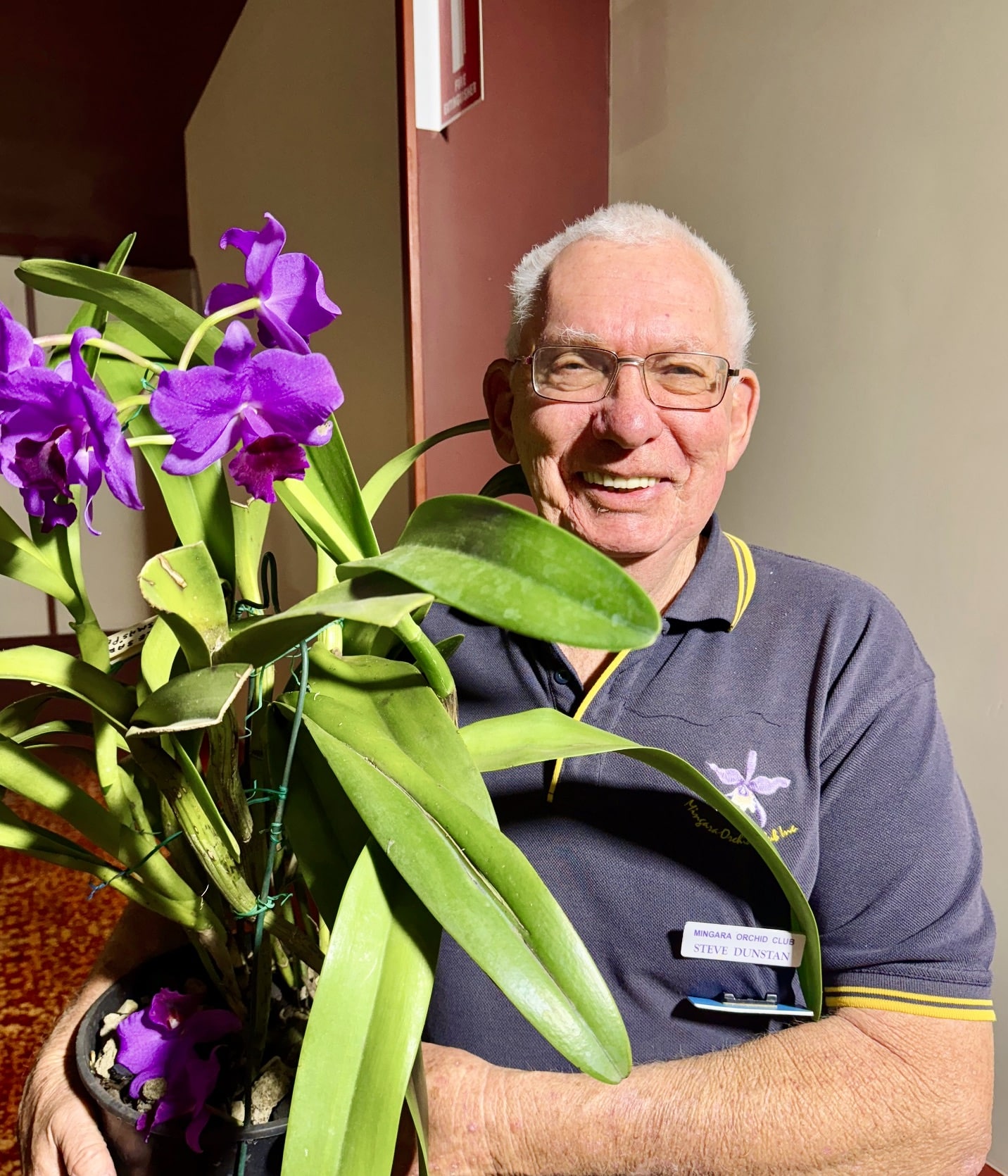 Steve Dunstan holding orchids